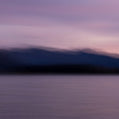 Fine art photography print of a moody purple and blue twilight over Lake Wanaka mountains created with intentional camera movement