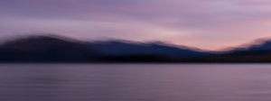 Fine art photography print of a moody purple and blue twilight over Lake Wanaka mountains created with intentional camera movement