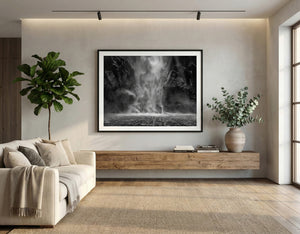 Black and white Milford Sound waterfall fine art photography print displayed in a modern living room