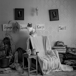 The Decision Maker, black and white fine art photography print, cat presiding over vintage room with Dump Donate Keep Sell signs, Michelle Fey, NZIPP Gold Award