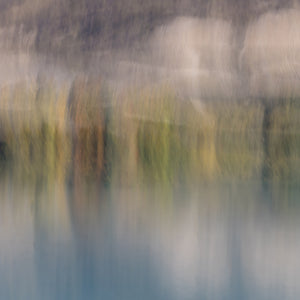 Abstract fine art photography print of trees reflected in still water with soft golden, green and blue tones  in Central Otago NZ