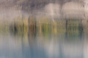 Abstract fine art photography print of trees reflected in still water with soft golden, green and blue tones  in Central Otago NZ